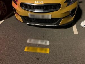 Yellow Kia Ceed on road