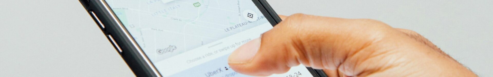 a person holding a cell phone in their hand