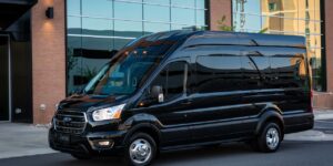 black modern ford transit on city road